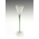 A cordial glass, circa 1900, probably Continental, the funnel bowl with green and white spiral twist