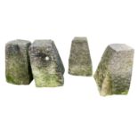 Four limestone staddle stone bases. Each approximately 55cm high.