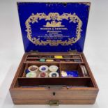A Victorian Winsor & Newton mahogany artist's box, fitted with lift-out compartments and a lower
