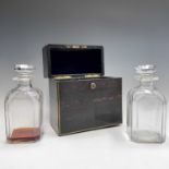 A 19th century coromandel wood and brass bound decanter box, with white metal monogram to lid,