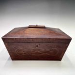 A Regency mahogany crossbanded and inlaid workbox of sarcophagus shape, the interior fitted a lift-