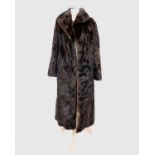 A ladies three-quarter length mink fur coat, approximate size 6-8.