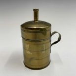 A brass bougie box, early 19th century, with ring turned decoration and simple loop handle, height