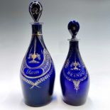 A 19th century Bristol blue glass decanter with stopper, inscribed 'Rum' and with elaborate gilded