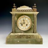 A Victorian green onyx and gilt metal mantel clock, height 31cm, width 27.5cm.