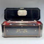 A late 19th century Swiss music box, playing eight airs on the 19 1/2" cylinder, the white metal