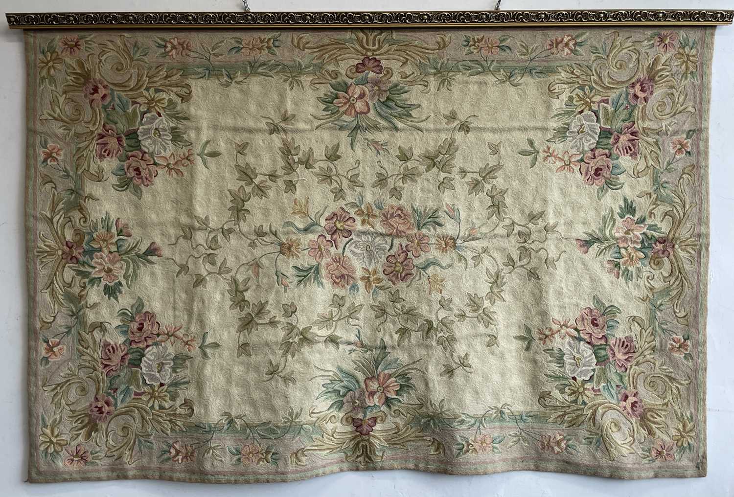 An Aubusson-type floral design wall hanging, mounted on gilded wood hanging rail. Maximum width