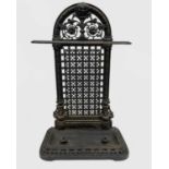 A Victorian cast iron stick stand, possibly Coalbrookdale, the arch back with foliate scroll and