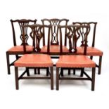 A matched group of five 19th century mahogany dining chairs in the Chippendale taste, including