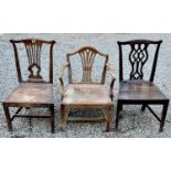 A 19th century fruitwood elbow chair with solid seat, on square legs, together with two other chairs