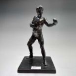 A patinated spelter figure of a pugilist, 1930s, modelled on a square base, height 19cm.