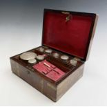 An early 19th century rosewood and brass bound campaign travel box, fitted with a mirror and