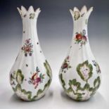 A pair of Chelsea fluted baluster vases or guglets, circa 1760, painted in coloured enamels with