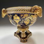 A Derby large size pot pourri vase, circa 1815, decorated in blue and gilt with triple ram's mask