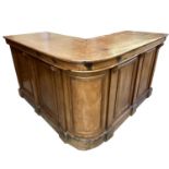 A Victorian mahogany shop counter, of right angle section, the top with rounded corners and with