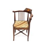 An Edwardian mahogany and inlaid corner chair, with upholstered seat on square legs, height 78cm.