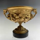 A gilt bronze twin handled urn, late 19th century, moulded in deep relief with convolvulus, on a