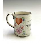 A good Swansea creamware mug, press moulded and decorated in various polychrome colours,