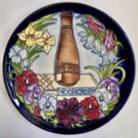 A limited-edition Moorcroft 'Centennial Plate', designed by Rachel Bishop, painted and impressed
