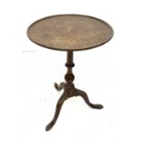 A late George III mahogany circular occasional table, with turned pillar and tripod base, height