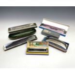 A Hohner Band harmonica, boxed, together with six other assorted harmonicas (7).