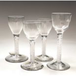 An 18th century cordial glass, raised on a multi twist opaque white stem, height 14.6cm, another