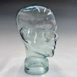 A moulded glass shop display head. Height 25cm.