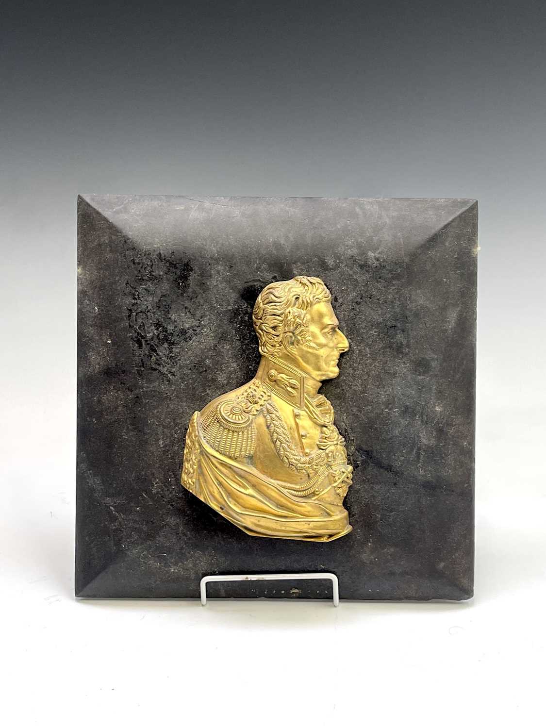 A gilt bronze profile bust of The Duke of Wellington, 19th century, mounted on a square hardwood