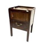 A George III mahogany tray top night cupboard, fitted a single door and commode drawer below and