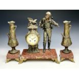 A French spelter three-piece clock garniture, entitled 'Le Depart Par Ranccoulet', with red marble