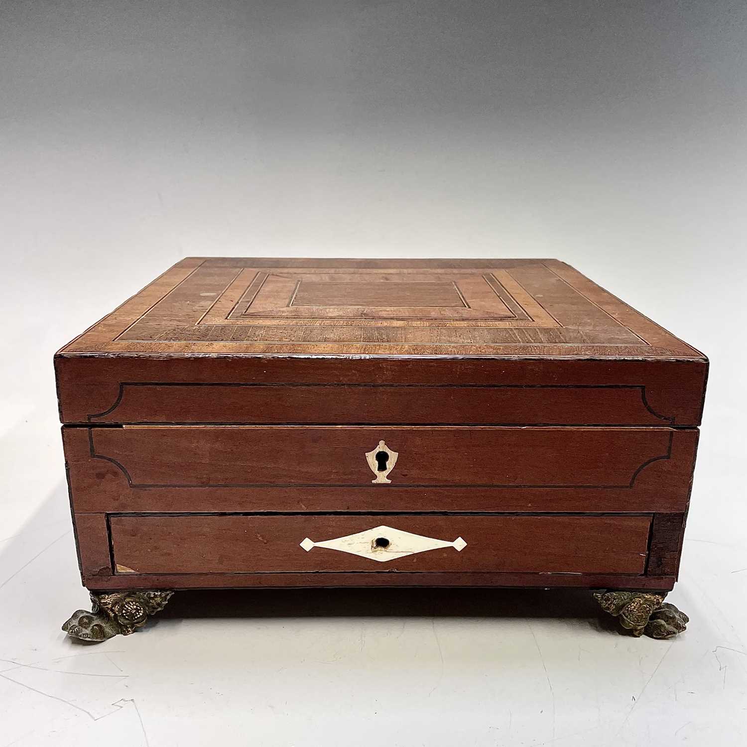 A Regency mahogany inlaid and crossbanded work box, with fitted interior and a lower drawer with