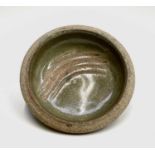 A Leach studio pottery small dish, with incised decoration, diameter 11.5cm.