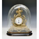 A French gilt metal mantel clock, 19th century, beneath a glass dome, on an ebonised stand, full