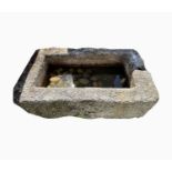 A large granite trough of rectangular form. Height 35cm, width 92cm, depth 55cm.Condition report: