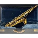 A gilt lacquered tenor saxophone, by C.G.Conn, engraved 'Made by C.G.Conn Ltd Elkhart-Ind USA Sole