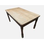 A Victorian pine kitchen table, the rectangular top with rounded corners, on partly turned square