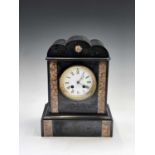 A late 19th century French mantel clock, the white enamel dial in a black slate and marble case.