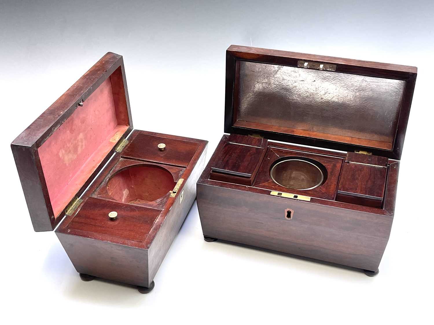 A William IV mahogany sarcophagus shape tea caddy, the interior fitted with two lidded compartments,