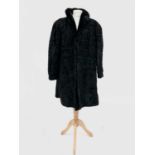 A 1960's ladies astrakhan fur coat, size small; together with another astrakhan coat by Giddings