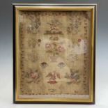 A 19th century sampler, embroidered with the name 'Mrs. Bell', birds, baskets of flowers, trees etc,