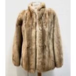 A ladies blonde mink short-length fur coat, bearing label 'M. Michaels Exeter & Torquay' approximate