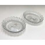 A pair of late George III Irish cut glass oval dishes, with scalloped borders and star cut bases,