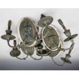 A set of four Neo-Classical style brass twin branch light fittings with applied rams heads, width