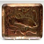 A Newlyn copper rectangular small dish, repousse decorated with a fish and seaweed. Width 14.5cm.