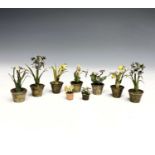 A collection of nine Viennese cold-painted bronze models of potted plants. The largest 4.5cm tall.