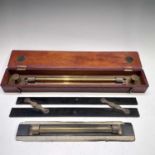 A brass rolling rule, stamped UWW Makers Birmingham (Universal Wood Working Co), in mahogany box,