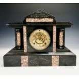 A Victorian black slate and marble mantel clock, height 34cm, width 44cm.