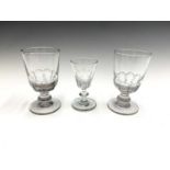 A pair of Victorian glass rummers with quarter fluted bowls, height 14cm, and one other glass. (3)