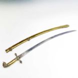 A Victorian brass sword, with 69cm single edged, slightly curved blade, one piece cast brass