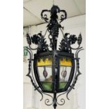 A wrought metal stained glass hall lantern, height 70cm.